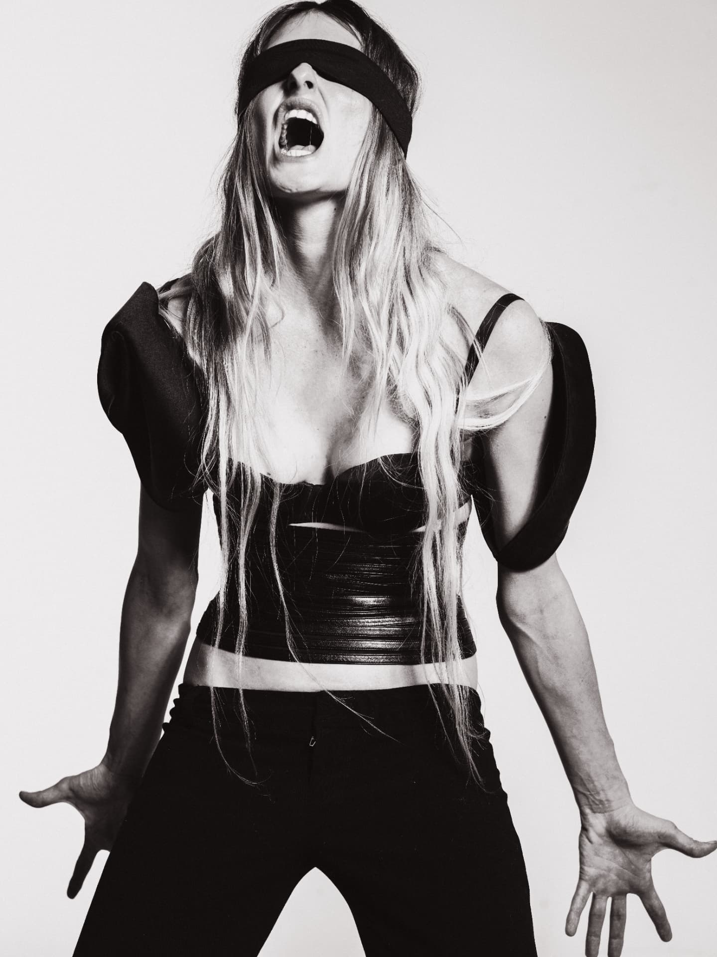 Agnes Azria performing in a black sculptural look